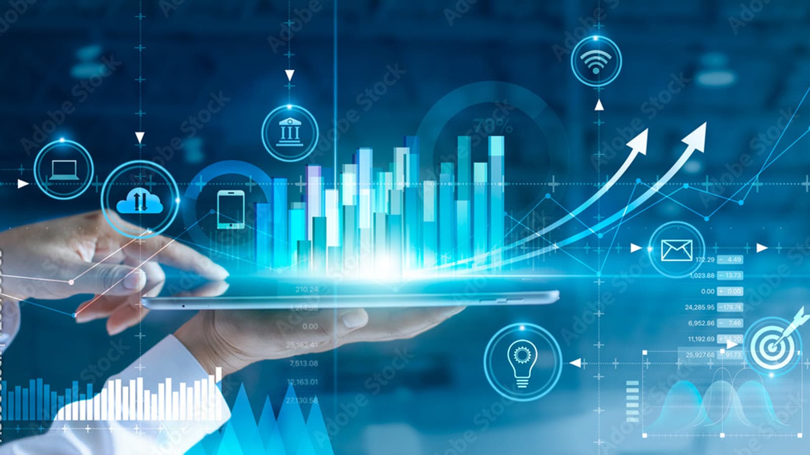 Hand holding a tablet from which holographic analytics charts rise